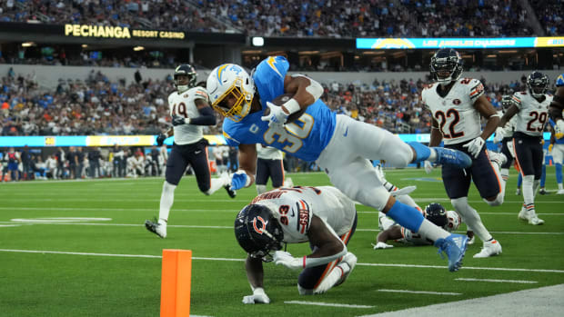 Austin Ekeler dives for a 39-yard TD over the tackle of Jaylon Johnson.